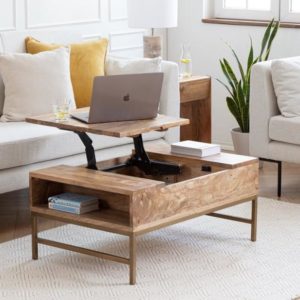 Elevated wooden coffee table with an adjustable top.