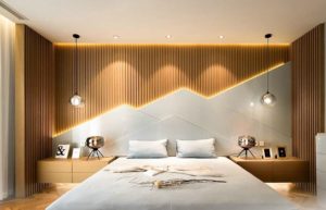 A bedroom with wooden slats illuminated by ambient lighting.
