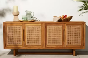 A wooden cabinet with woven rattan panels.